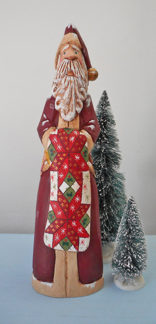 Hand Carved Father Christmas Santa with Quilt