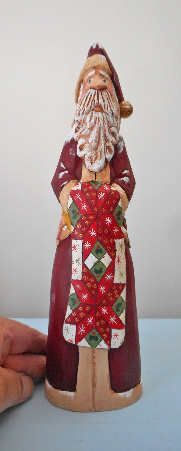 Hand Carved Father Christmas Santa with Quilt
