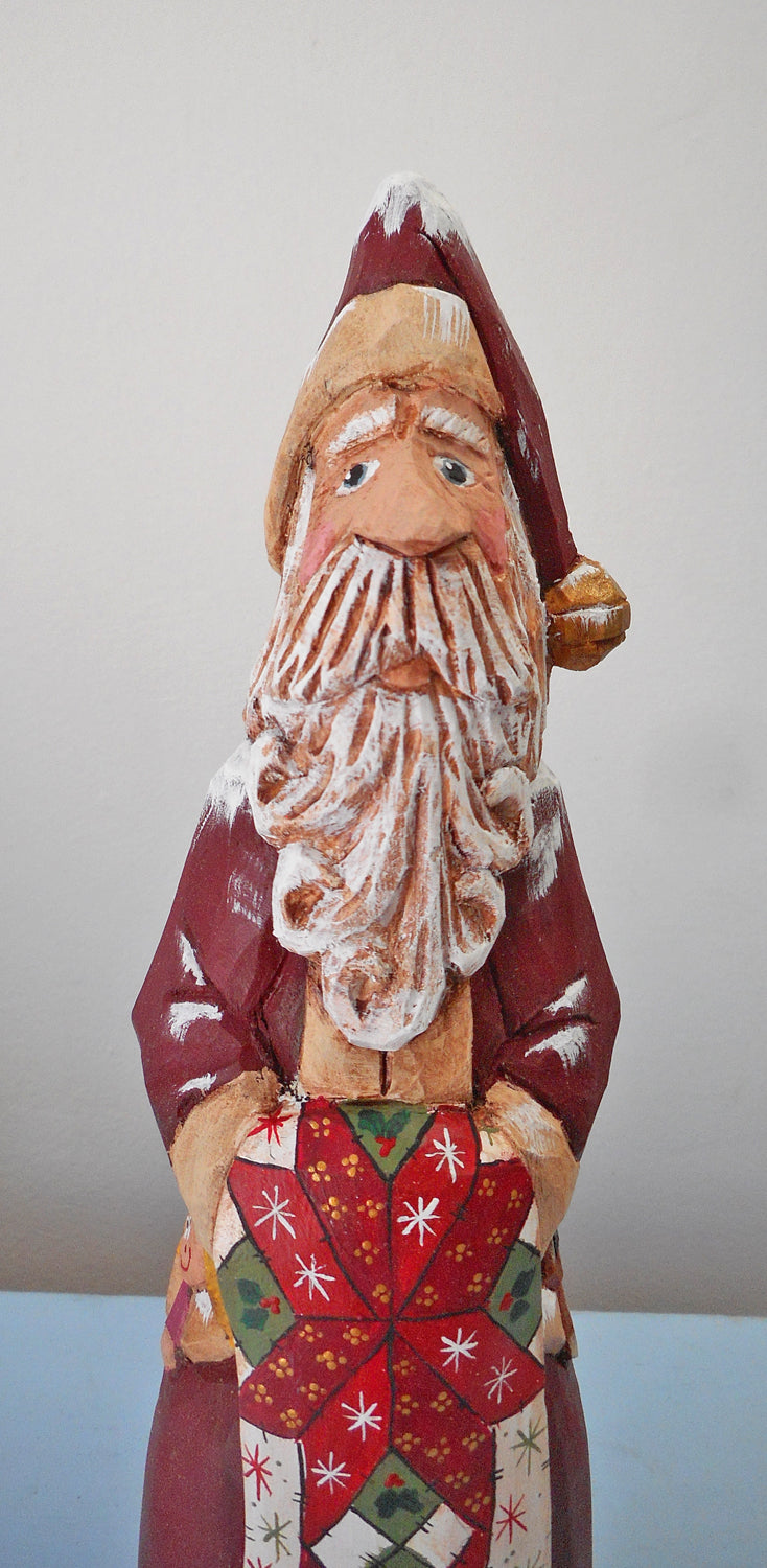 Hand Carved Father Christmas Santa with Quilt