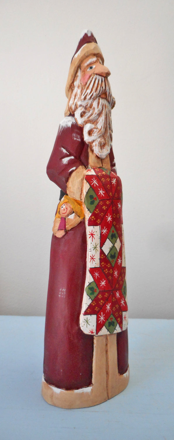 Hand Carved Father Christmas Santa with Quilt