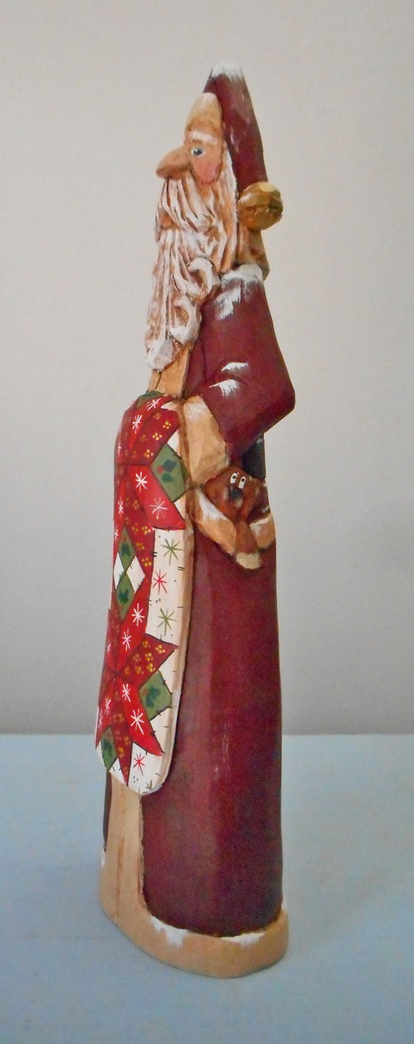 Hand Carved Father Christmas Santa with Quilt