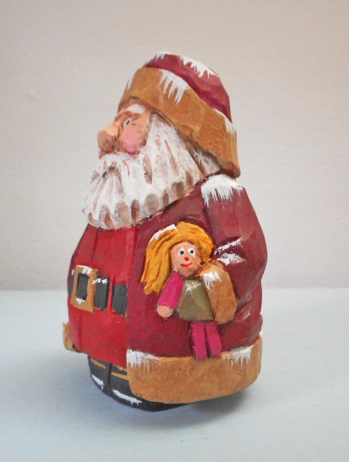 Wooden Chubby Santa Claus with doll