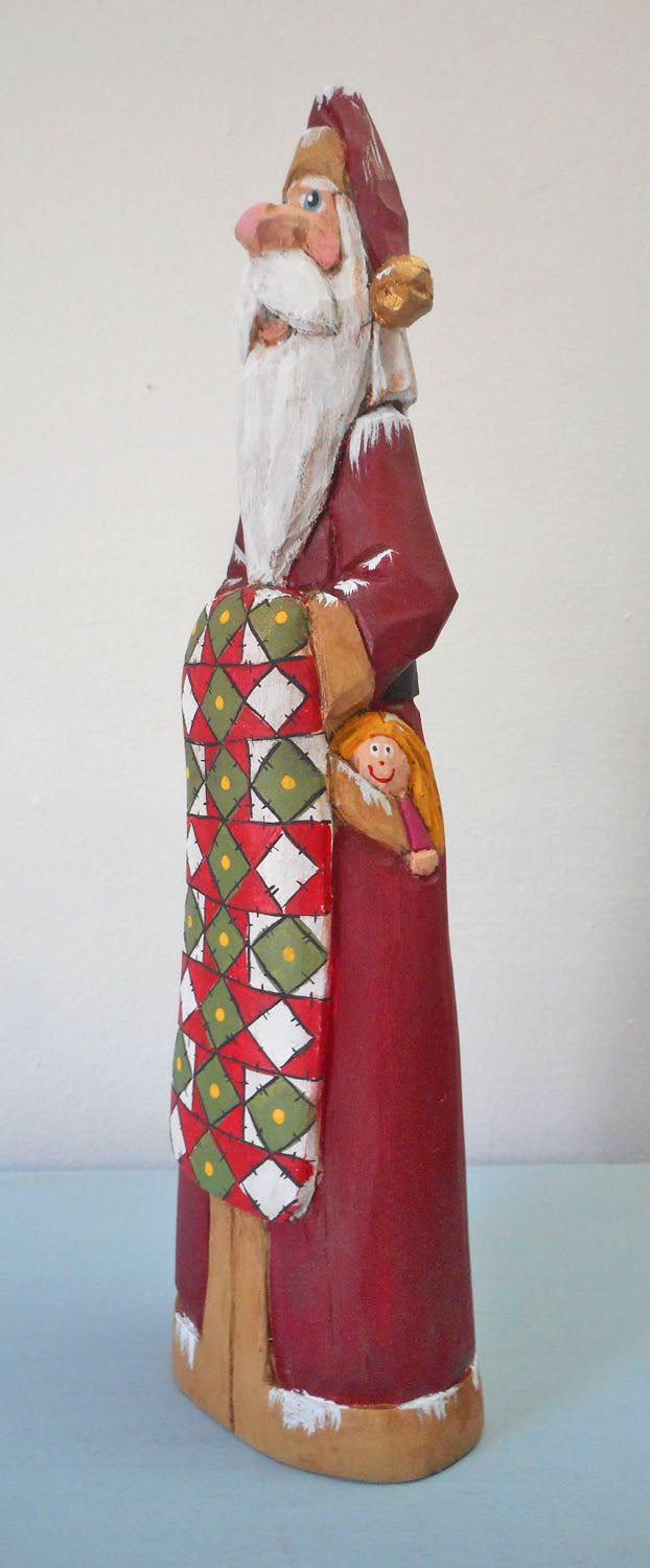 Hand Carved Father Christmas Santa with Quilt