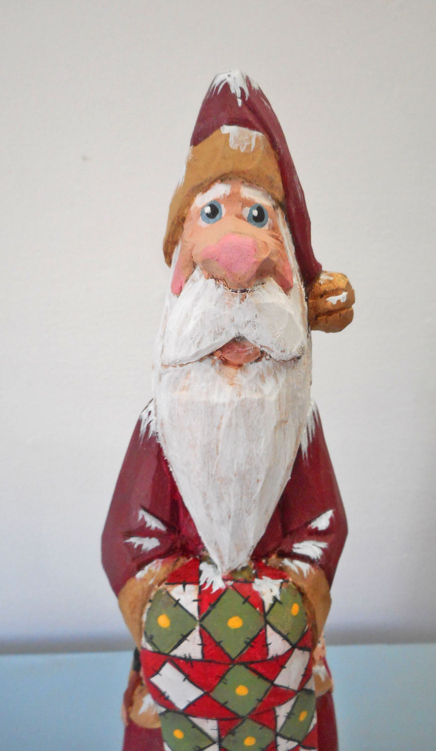 Hand Carved Father Christmas Santa with Quilt