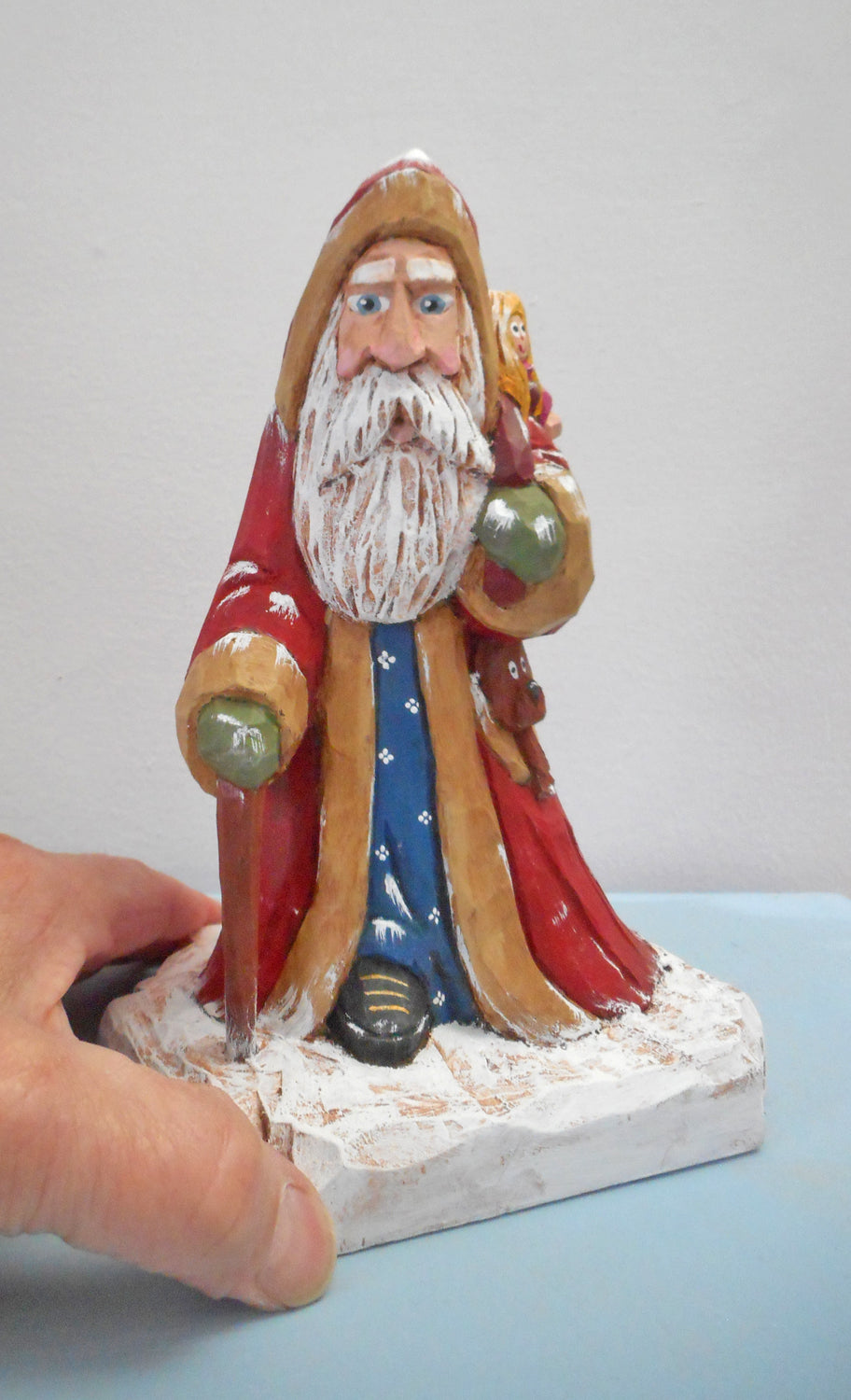Robe Santa Claus with Christmas sack woodcarving