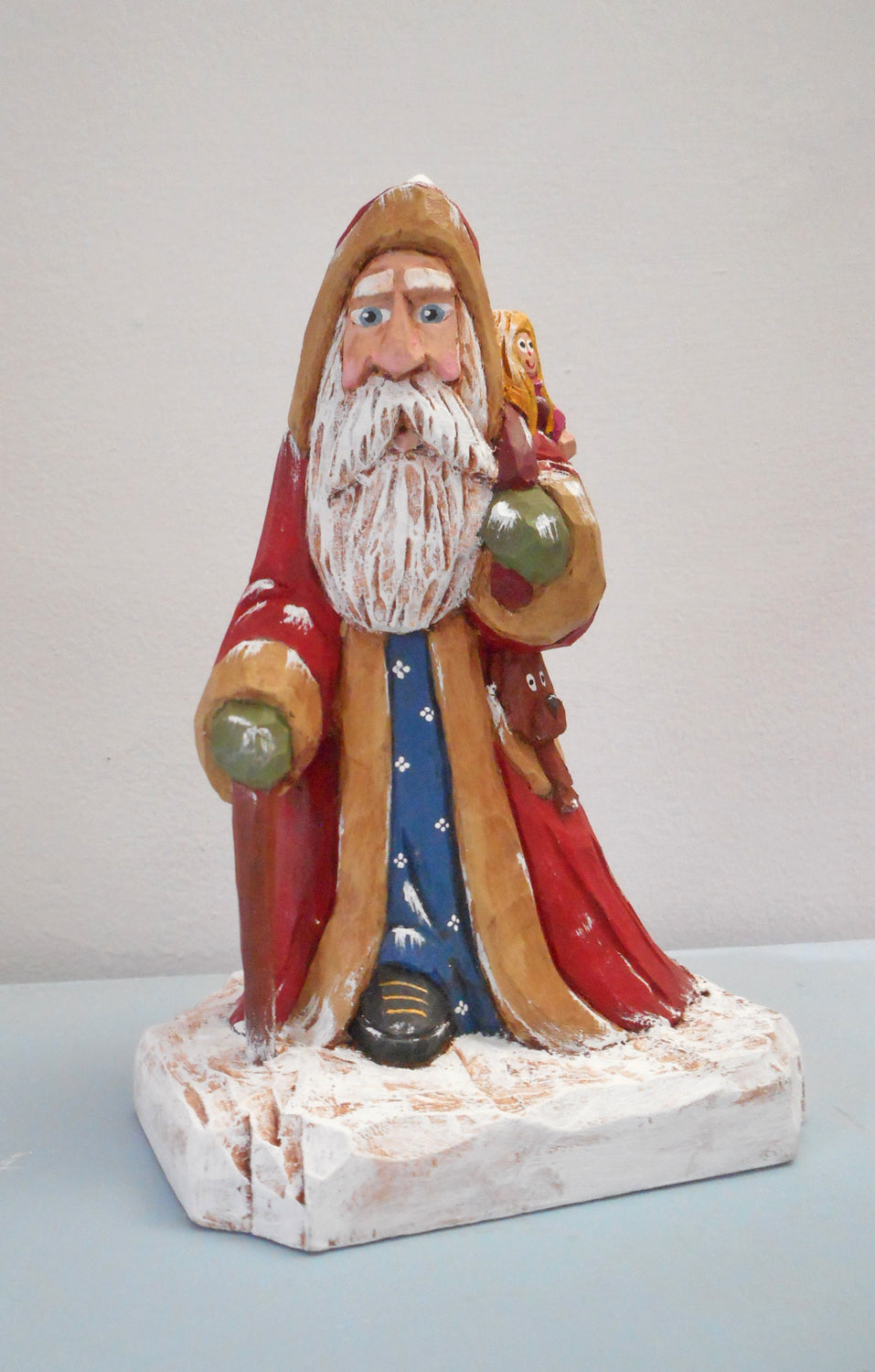 Robe Santa Claus with Christmas sack woodcarving