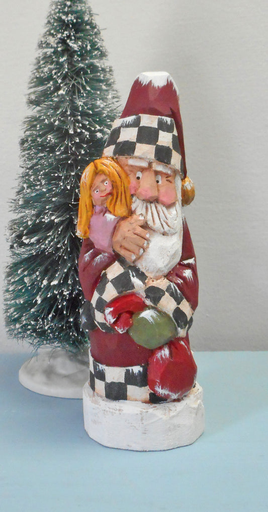 Hand carved Santa with child