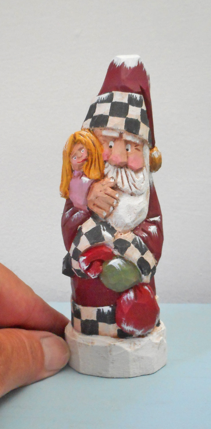 Hand carved Santa with child