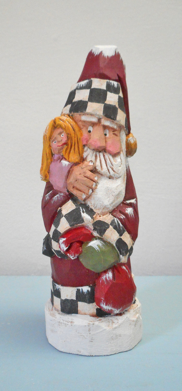 Hand carved Santa with child