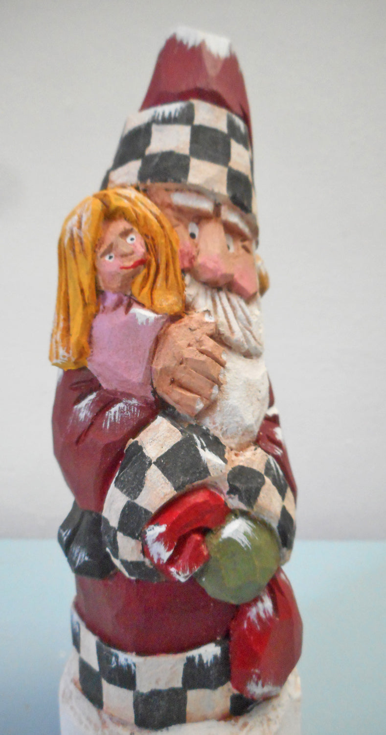Hand carved Santa with child