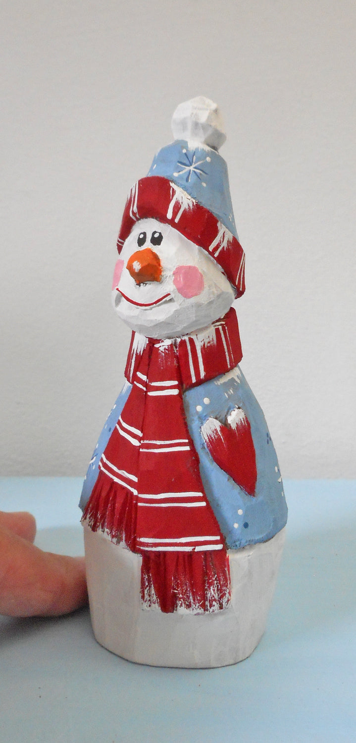 Snowman with heart decoration