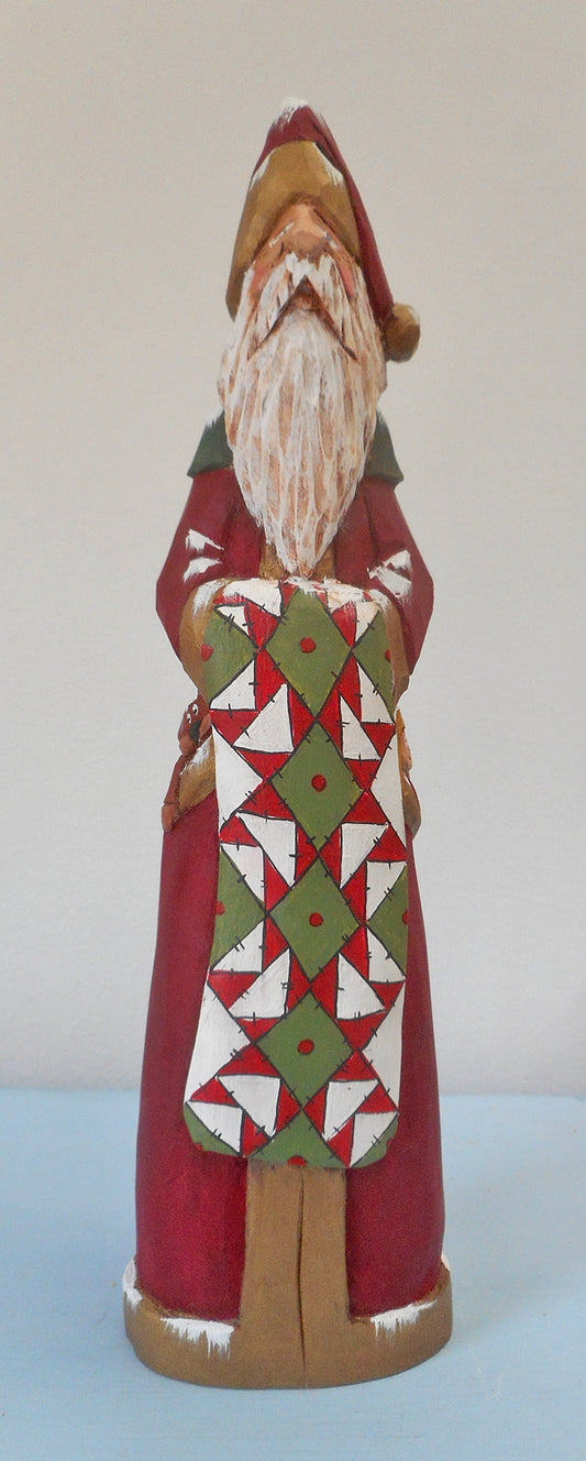 Hand Carved Father Christmas Santa with Quilt