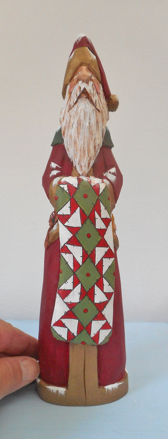 Hand Carved Father Christmas Santa with Quilt