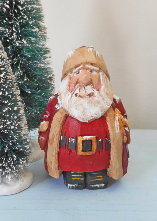 Santa Claus Woodcarving with doll