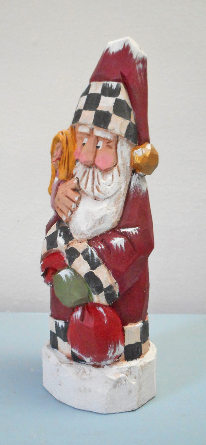 Hand carved Santa with child